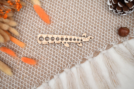 Knitting needle gauge branch