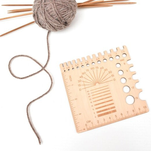 All in one needle gauge and Yarn/Wool spinning tool